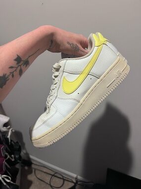 Nike White Low-Top Sneakers with Yellow Swoosh